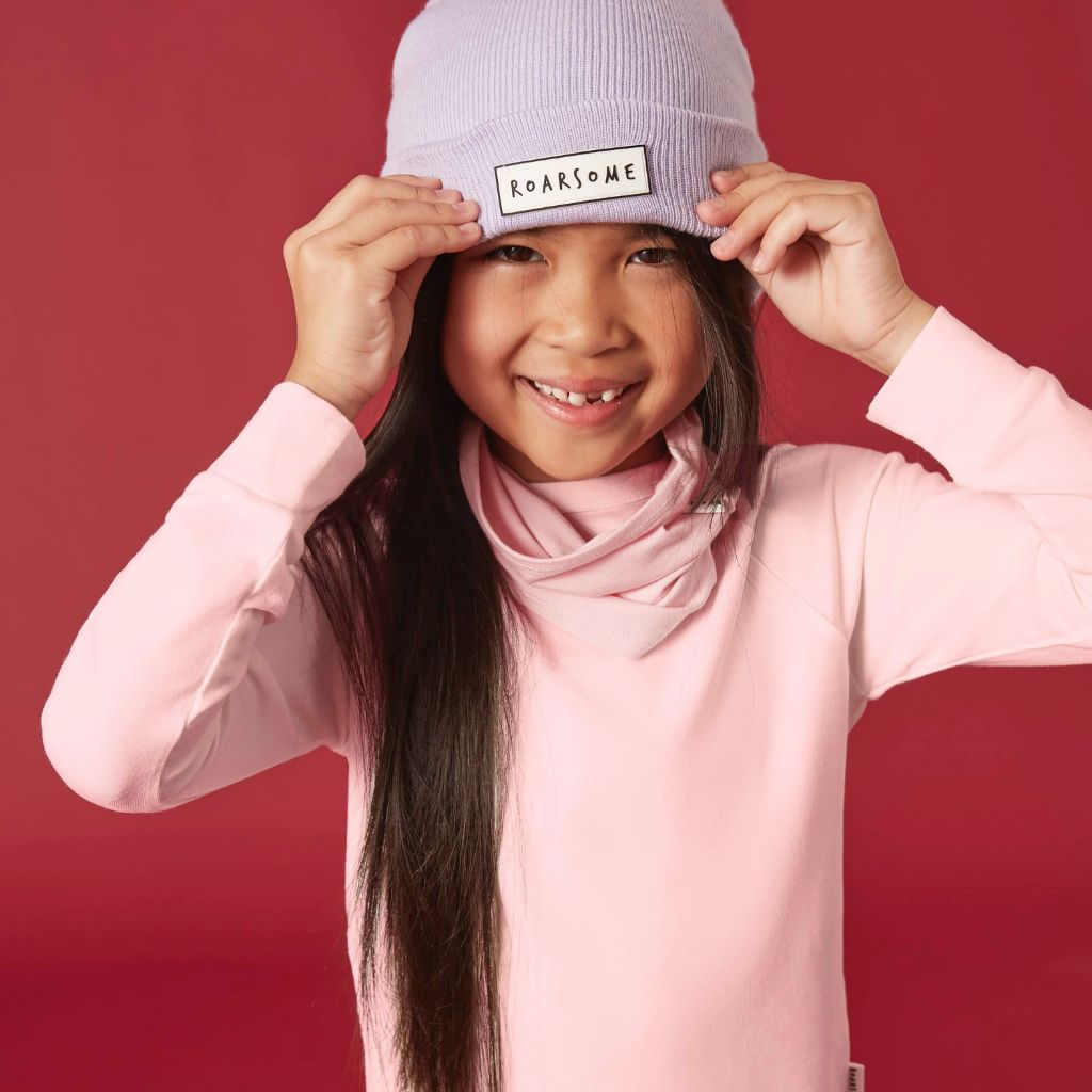 Little girl wearing Bamboo Base Layer thermals for Kids in Pink from Roarsome