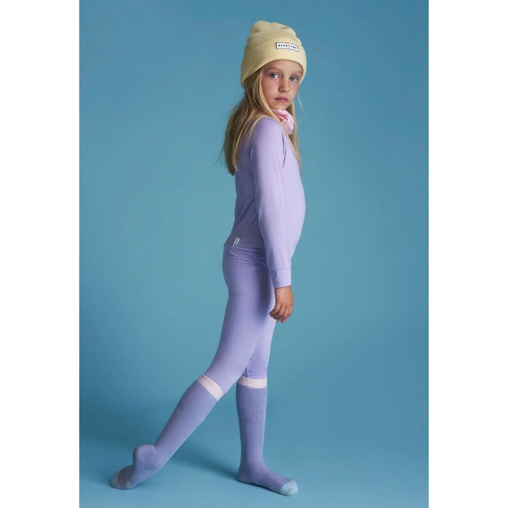 Little girl wearing Bamboo Base Layer thermals for Kids in Purple from Roarsome