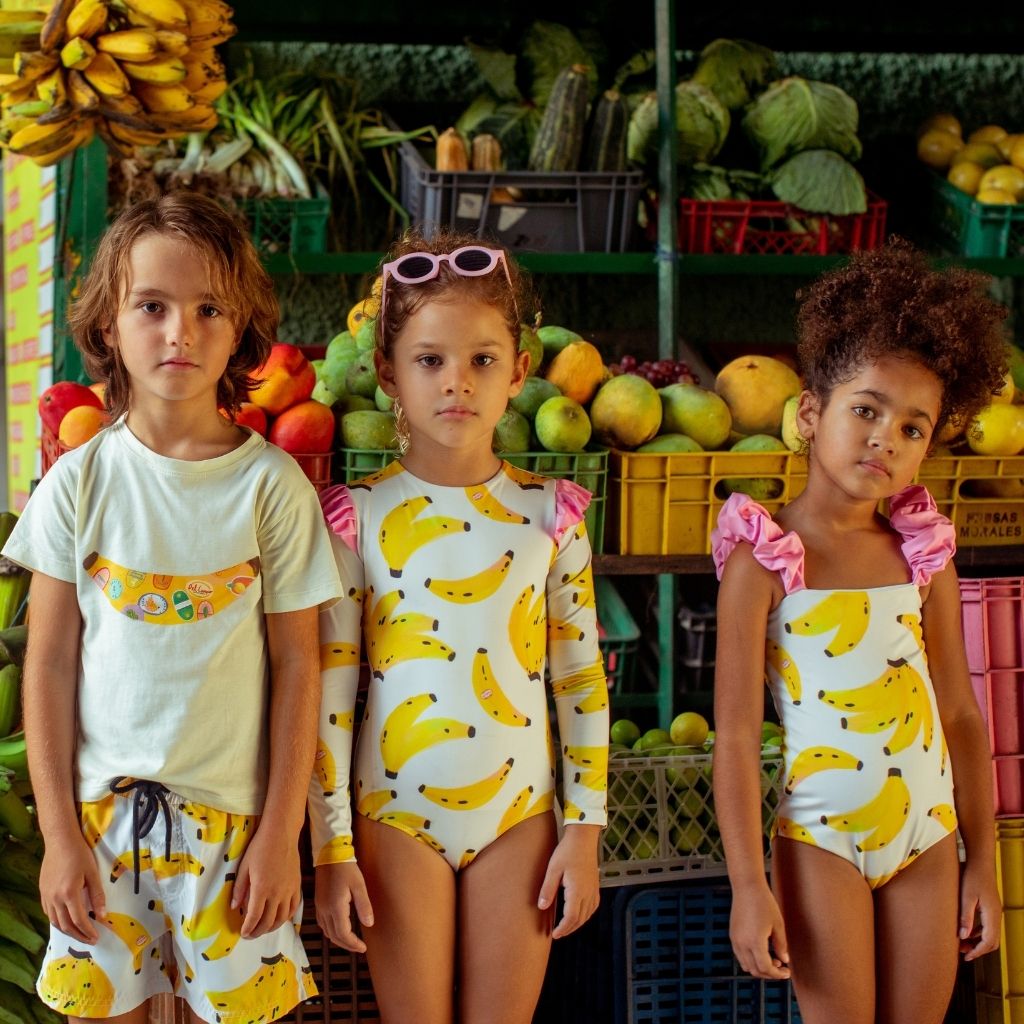 Little boy wearing the Banano Colombiano Swim Shorts from Colombian swim and resort wear brand Pepita & Me