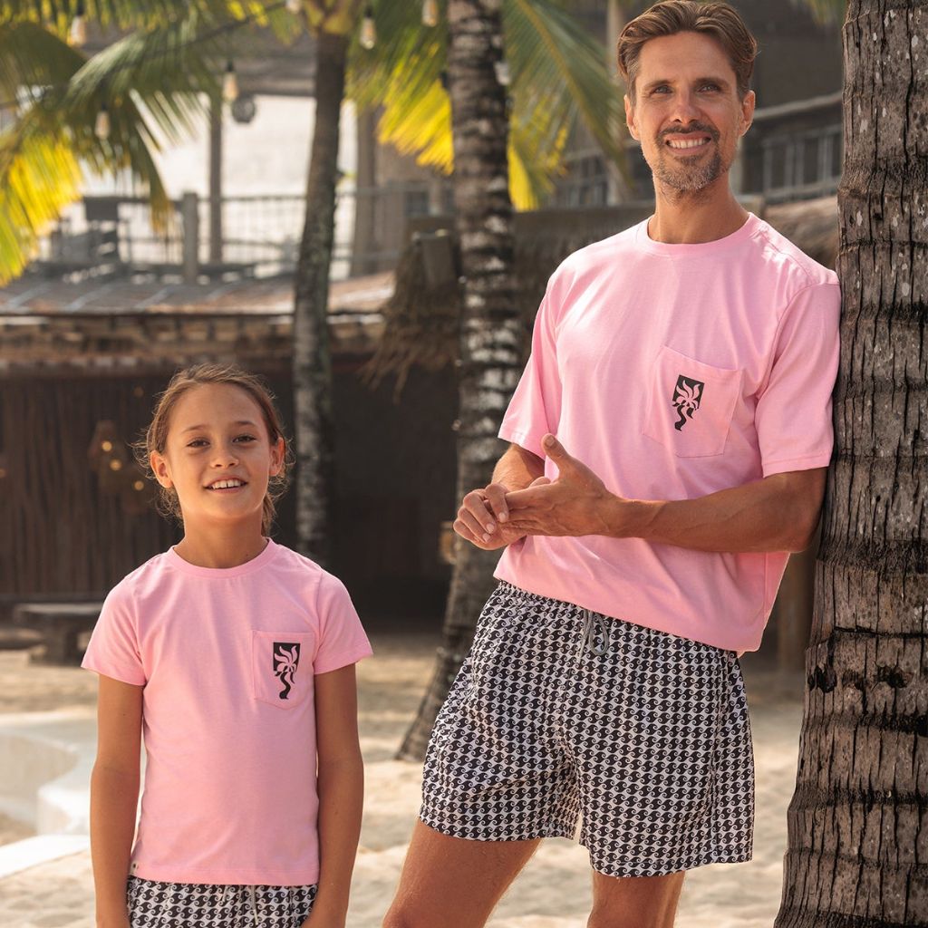 Father and son wearing the matching Clara Palm Kids T-Shirt from Boardies in Pink