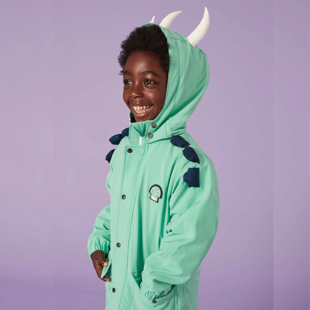 Little boy wearing the Everyday Raincoat in Spike the Dinosaur Green from Roarsome