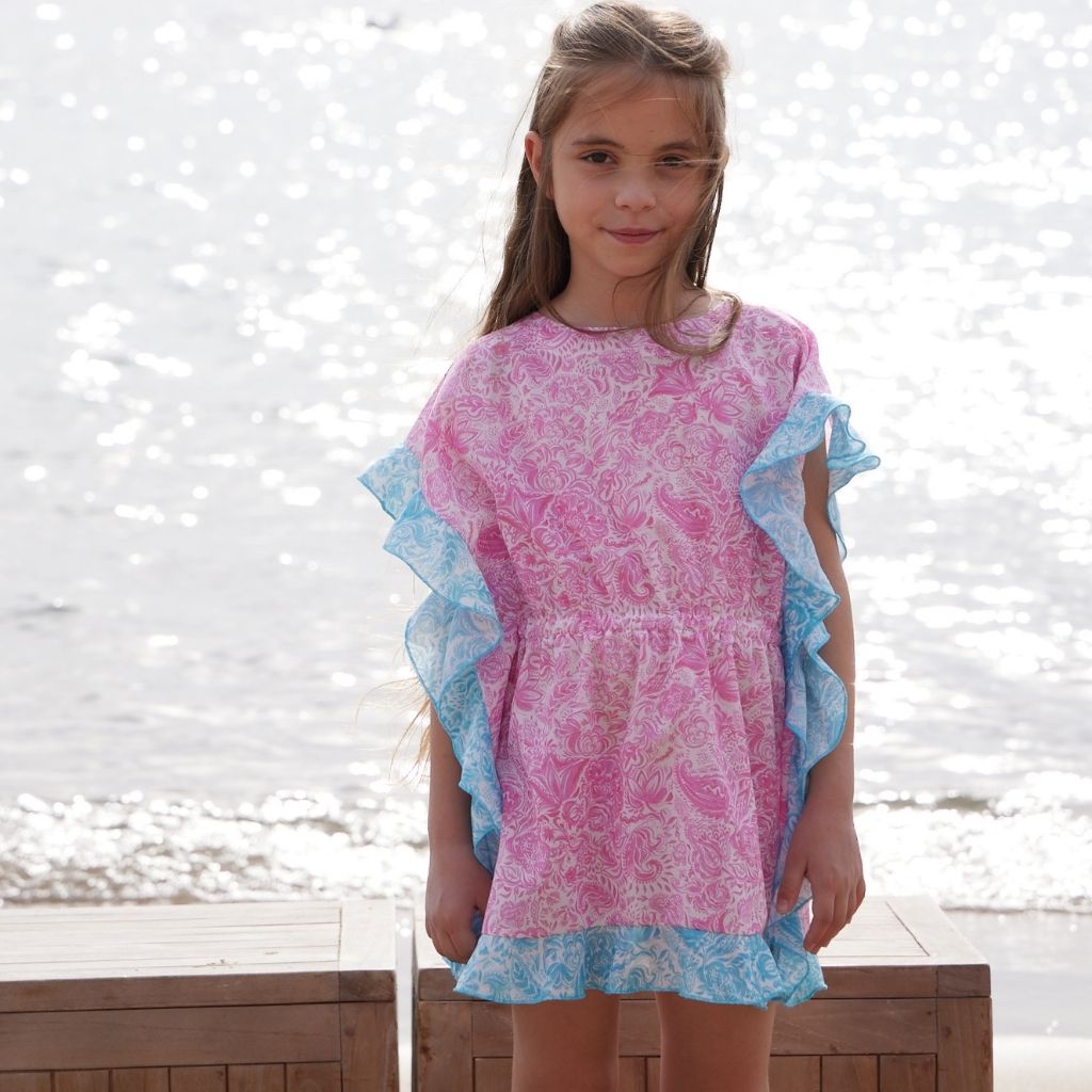 Little girl wearing the Paisley Pink Ruffled Kaftan from Marie Raxevsky