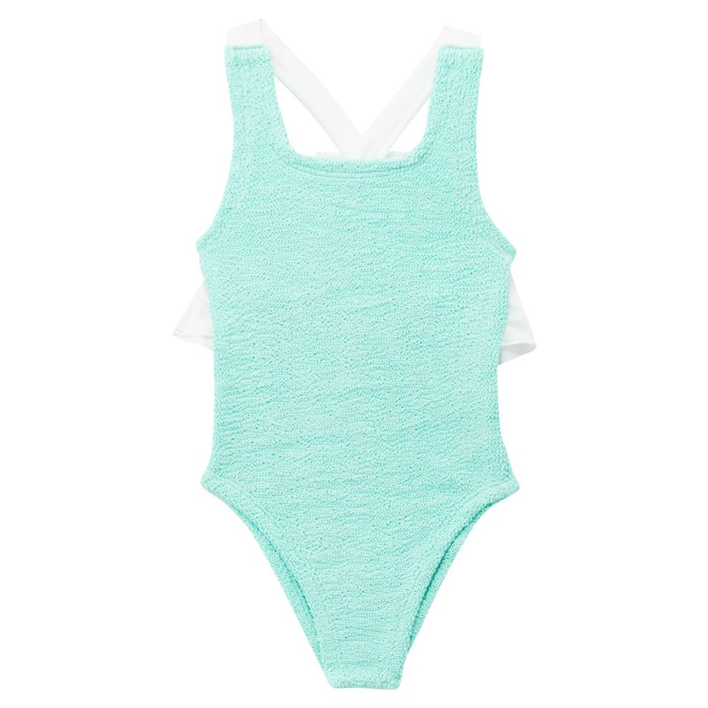 Image of the front of the Baby Lara swimsuit from Hunza G in a metallic mint colour way with a white bow on the back, for 3 - 6 year old girls.