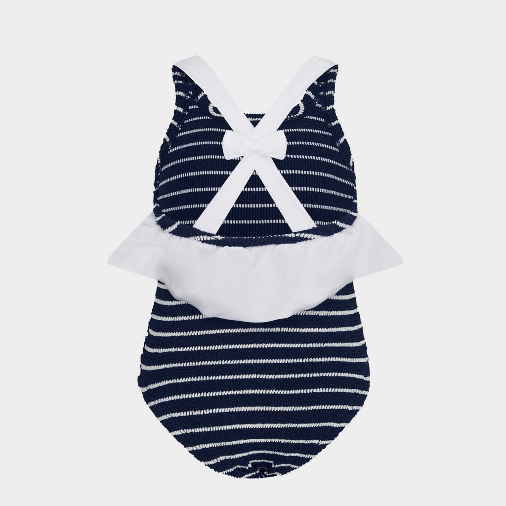 Image of the back of the Hunza G Baby Lara Swimsuit for 3 to 6 year olds in navy blue and white stripe