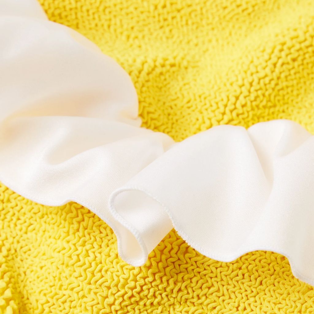 Close up of the fabric on the Kids Denise Swimsuit in Sunflower from Hunza G