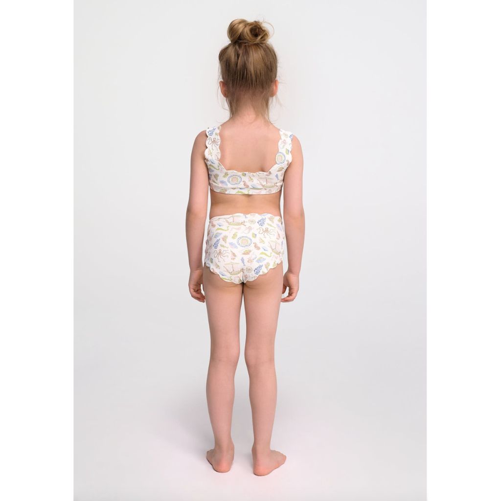 Little girl from the back wearing the Marysia Bumby Palm Springs Bikini Top and Santa Monica Bikini Bottoms in Cameo Print 1