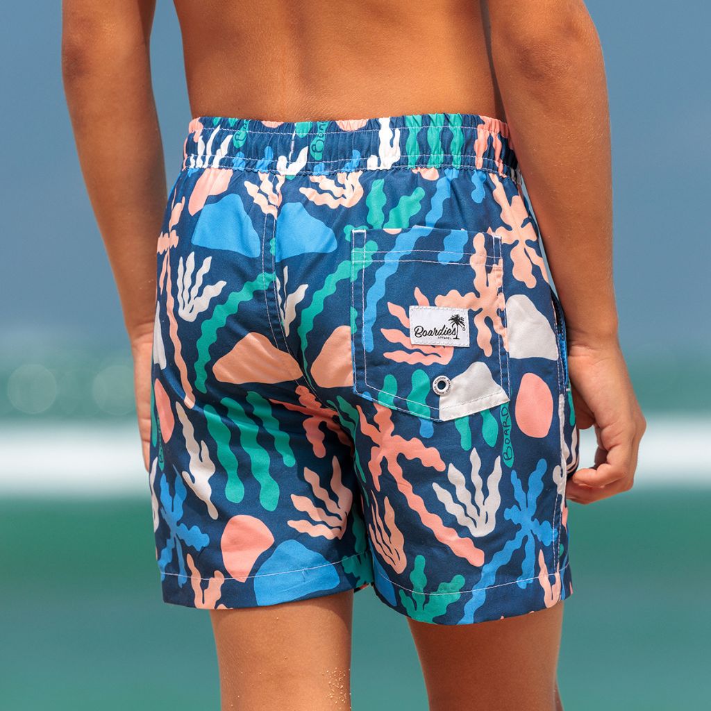 Little boy from the back wearing the Boardies Palm Spring Kids Swim Shorts
