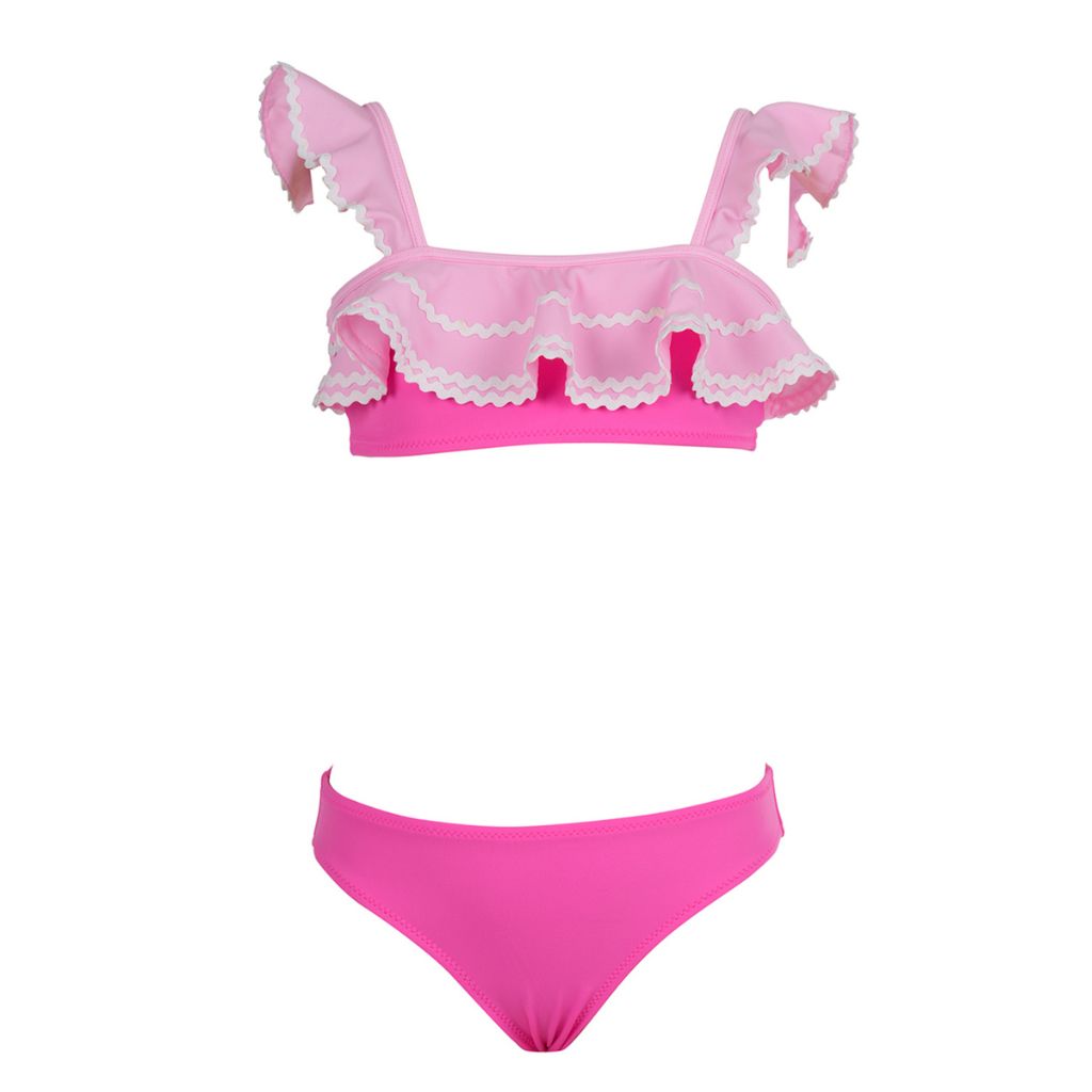 Product shot of the front of the Romane bikini from Nessi Byrd featuring a ruffled top in pink, new for Spring Summer 25.