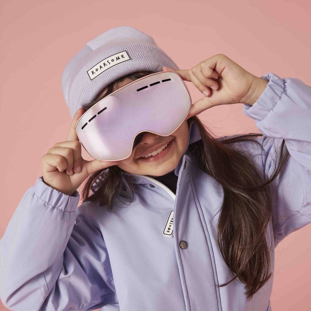 Person wearing pink goggles and a matching outfit against a pink background from Roarsome