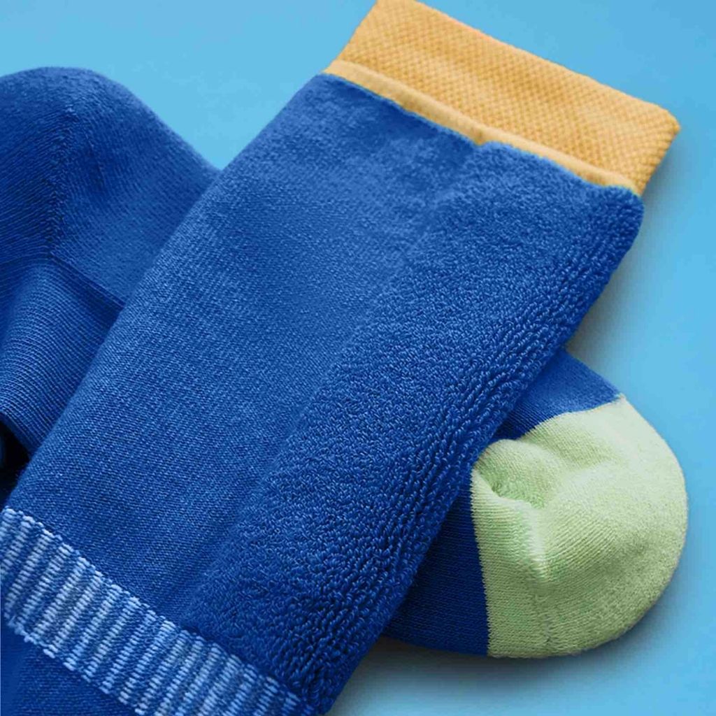 Close up of a Pair of blue ski socks from global outdoor kids brand Roarsome