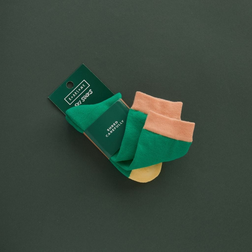 Shot of a Pair of green ski socks from global outdoor kids brand Roarsome