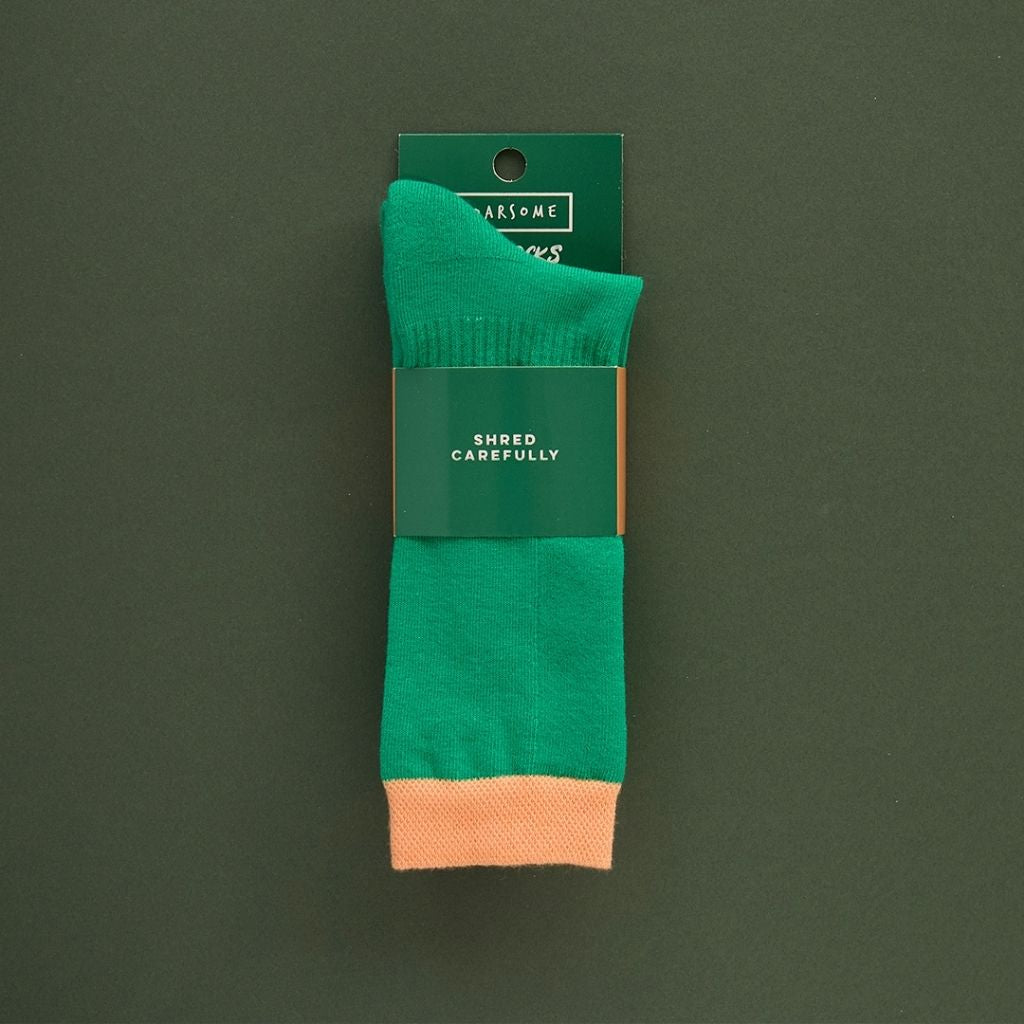 Packaging on a Pair of green ski socks from global outdoor kids brand Roarsome