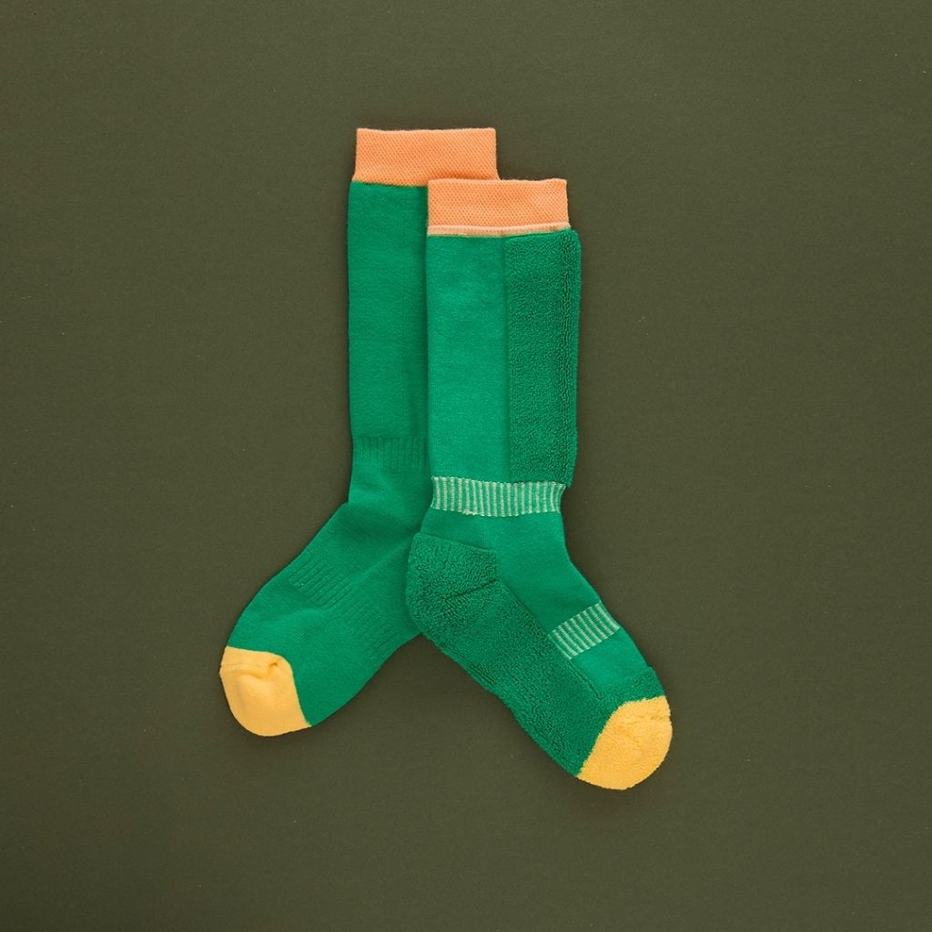 Pair of green ski socks from global outdoor kids brand Roarsome