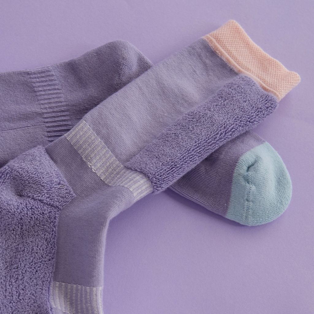 Close up of a Pair of purple ski socks from global outdoor kids brand Roarsome