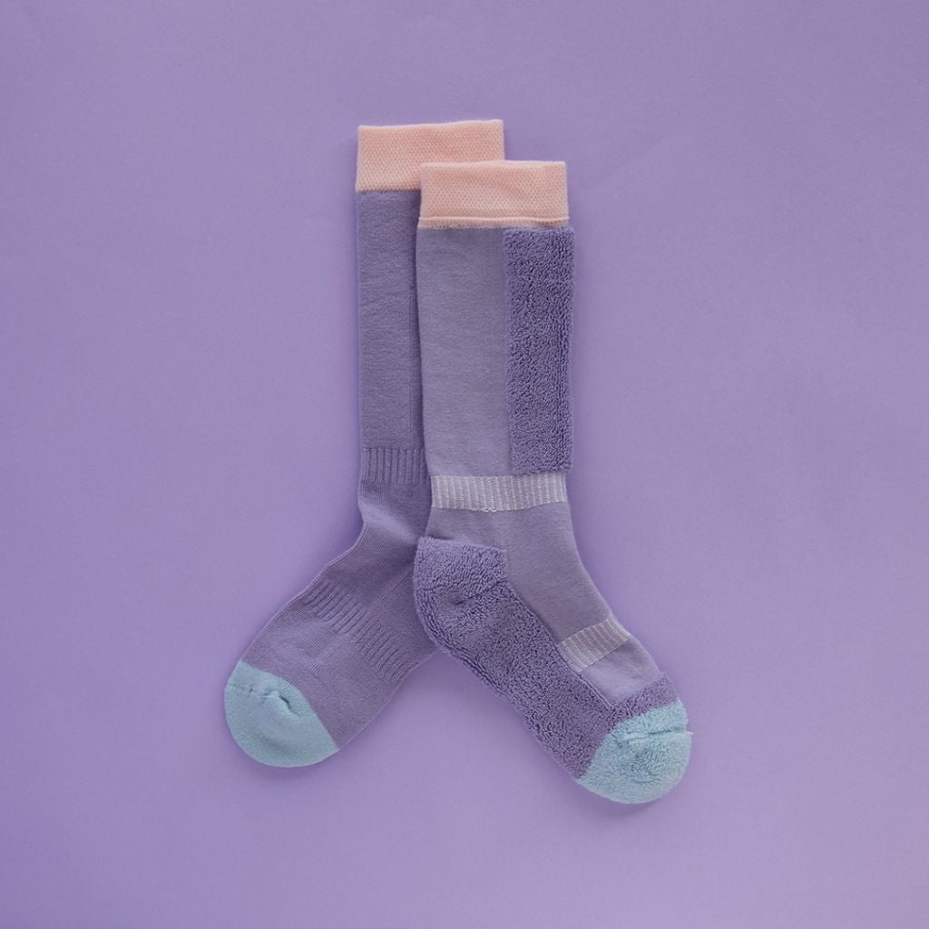 Pair of purple ski socks from global outdoor kids brand Roarsome