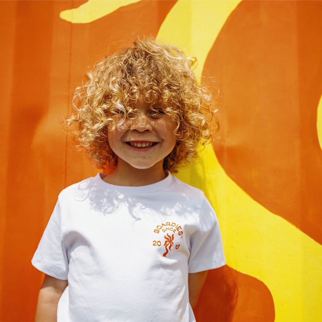 Little boy from the front wearing the Boardies Watergate Kids T-Shirt 